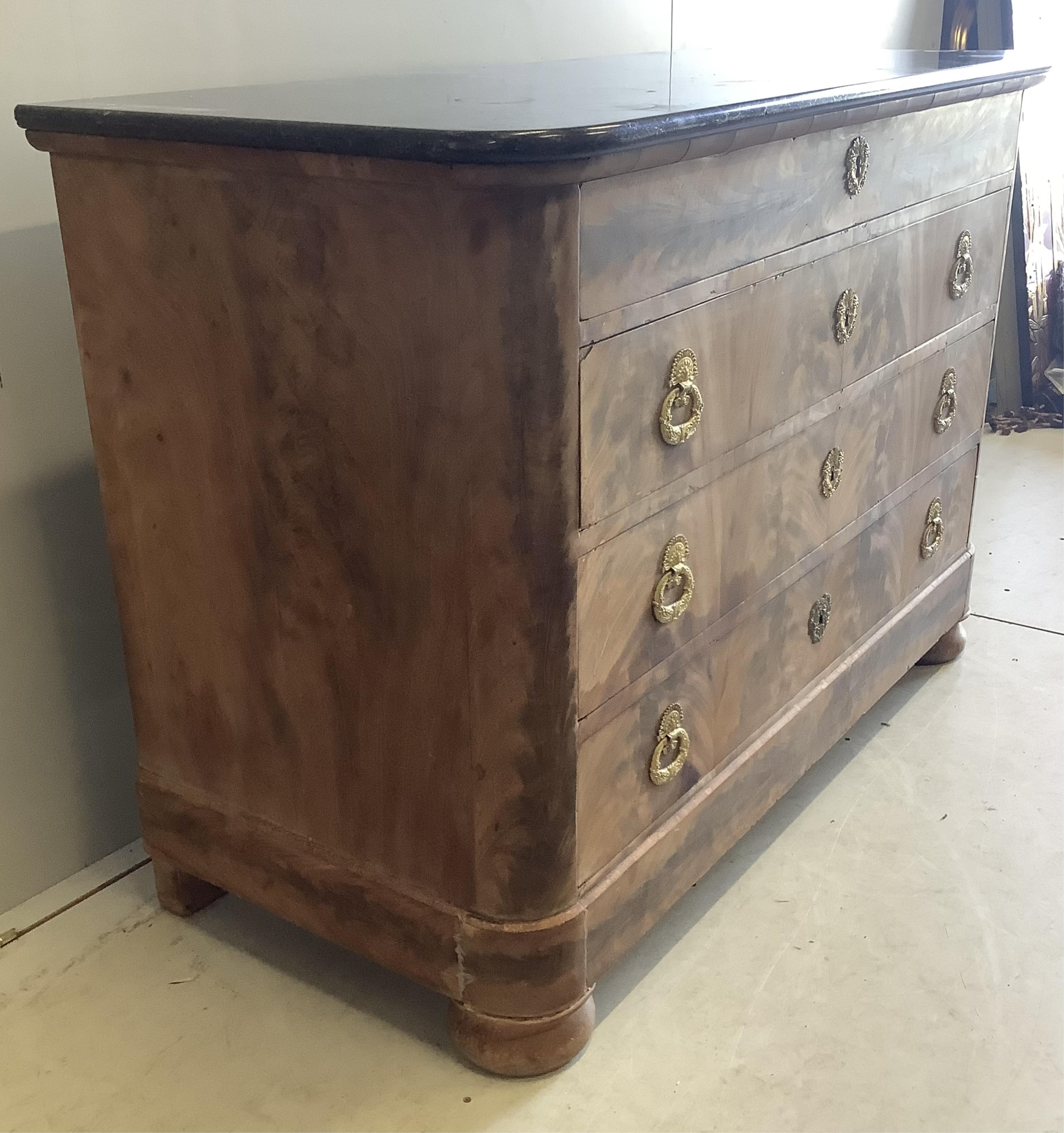 A 19th century French faded mahogany marble topped four drawer commode, width 130cm, depth 59cm, height 92cm. Condition - fair